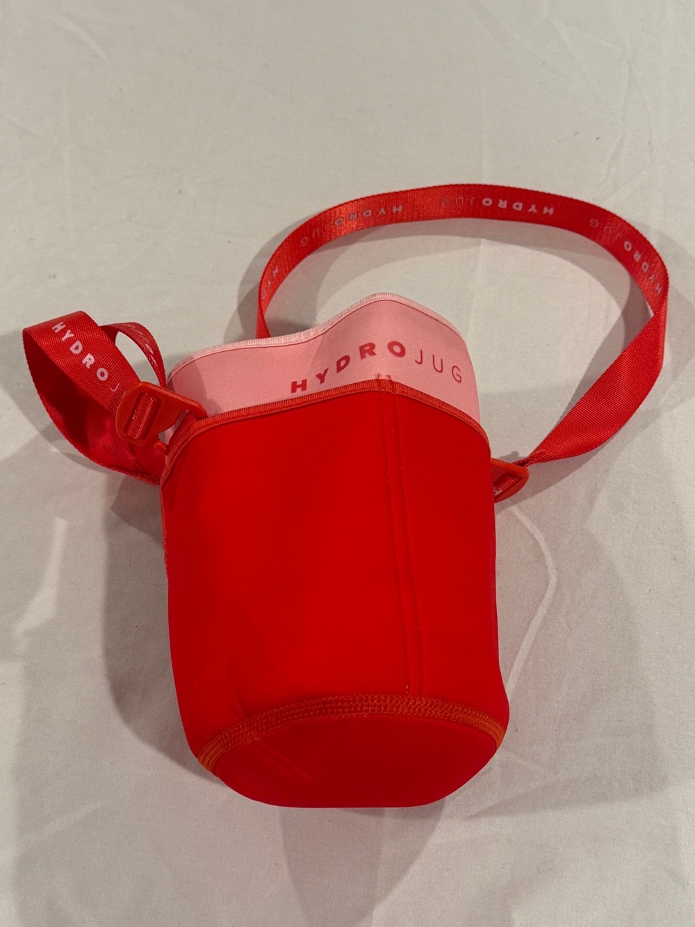 HydroJug Red Pink Double-Layer Neoprene Crossbody Bottle Carrier 73 64 oz cover